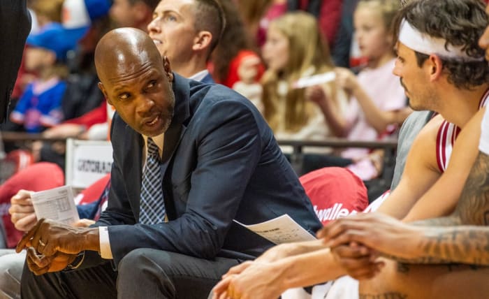 Indiana Director of Player Development Calbert Cheaney talks with Trey Galloway during the Indiana versus University of Indianapolis men's basketball game.